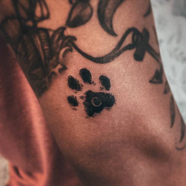 Stunning Paw Print Tattoo On Lady