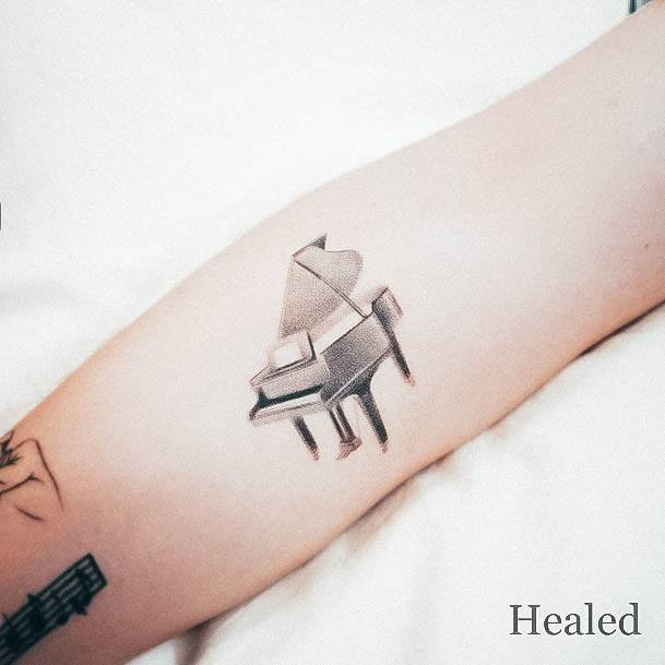 Stunning Piano Tattoo On Lady