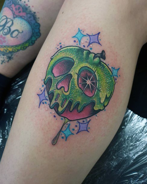 Stunning Poison Apple Tattoo On Lady