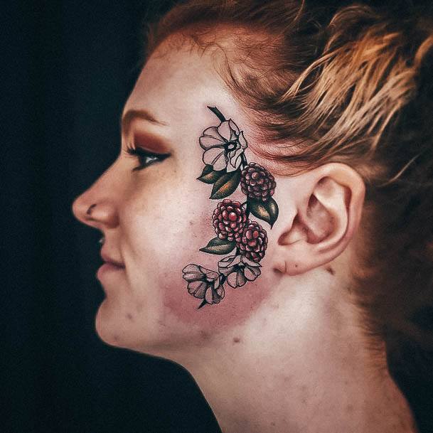 Stunning Raspberry Tattoo On Lady