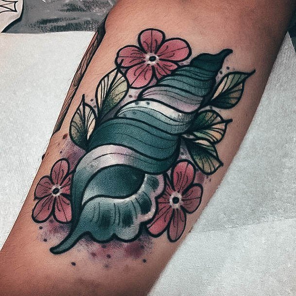 Stunning Seashell Tattoo On Lady