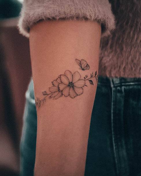 Stunning Simple Flower Tattoo On Lady