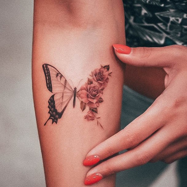 Stunning Small Butterfly Tattoo On Lady