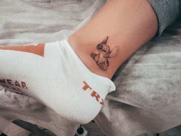 Stunning Stitch Tattoo On Lady