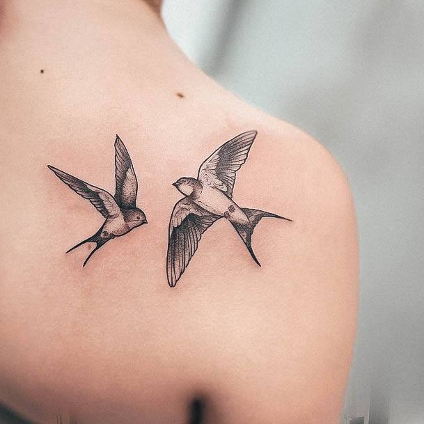 Stunning Swallow Tattoo On Lady