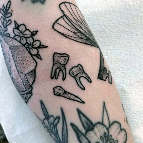 Stunning Tooth Tattoo On Lady