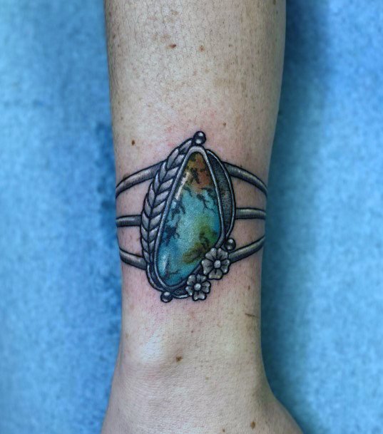 Stunning Turquoise Tattoo On Lady