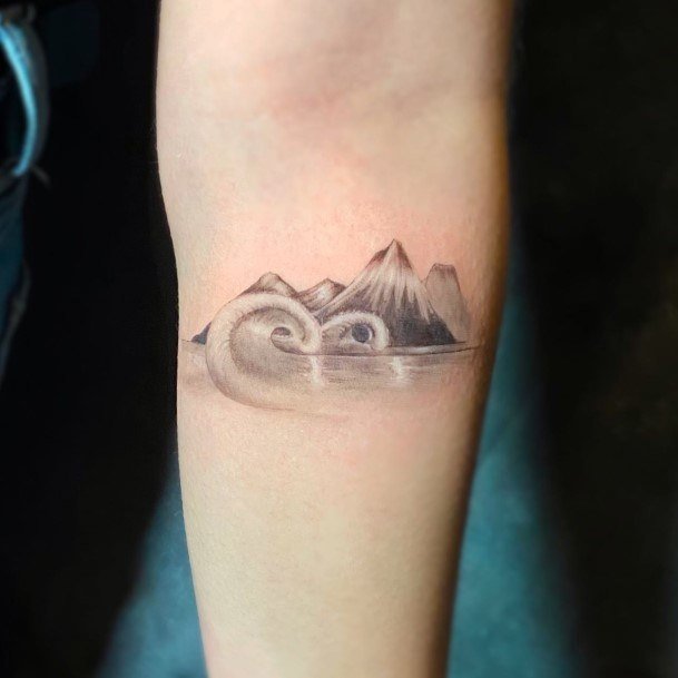 Stunning Volcano Tattoo On Lady