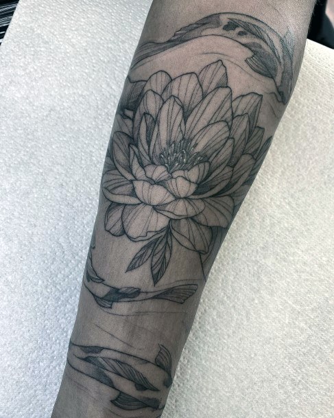 Stunning Water Lily Tattoo On Lady