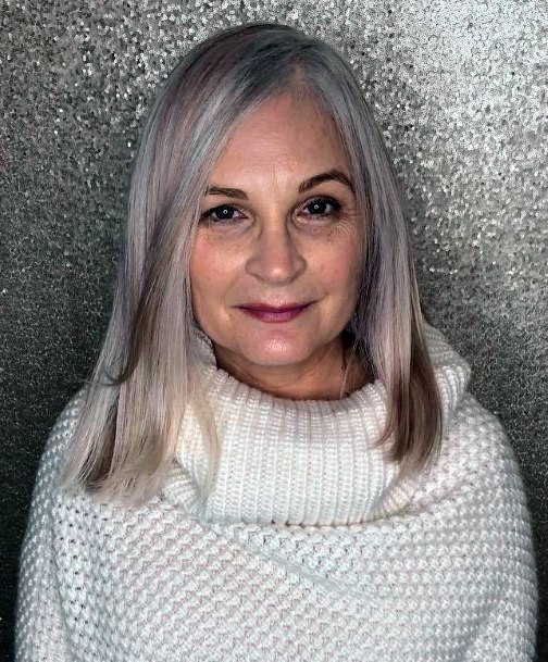 Subtle Pink Highlights Medium Length Hairstyles For Women Over 60