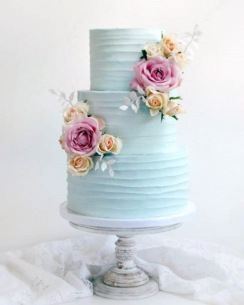 Swirls Of Light Blue Cream Wedding Cake