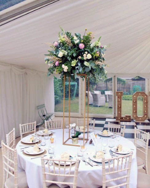 Tall Arrangement Of Summer Flowers Wedding Table