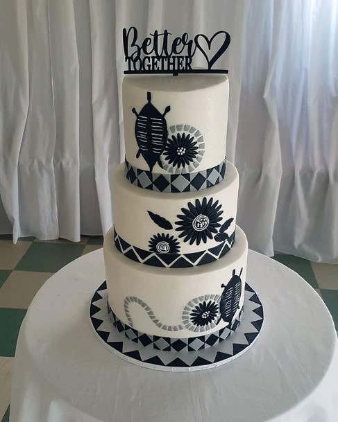 Tempting Black Art Work On White 3 Tier Wedding Cake Women