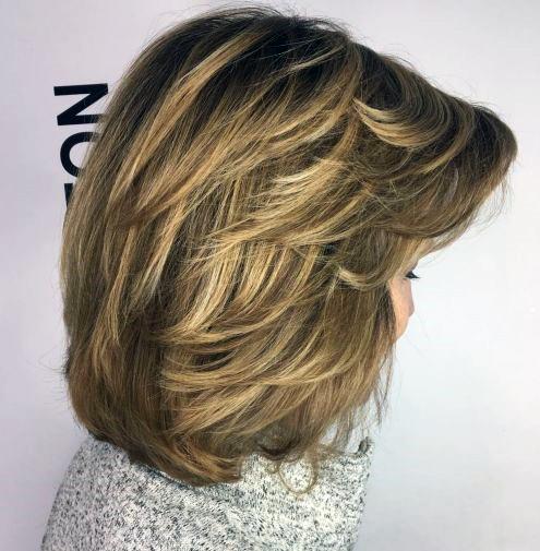 Thick Blonde Shoulder Length Hairstyle For 50 Year Old Woman With Thick Hair