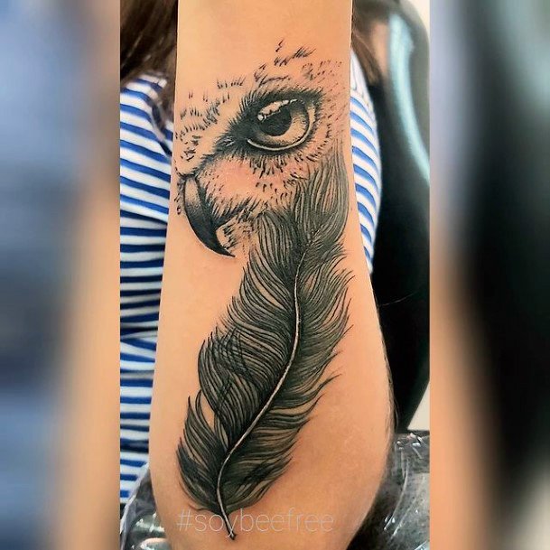 Thick Grey Feather And Eye Ball Tattoo Women