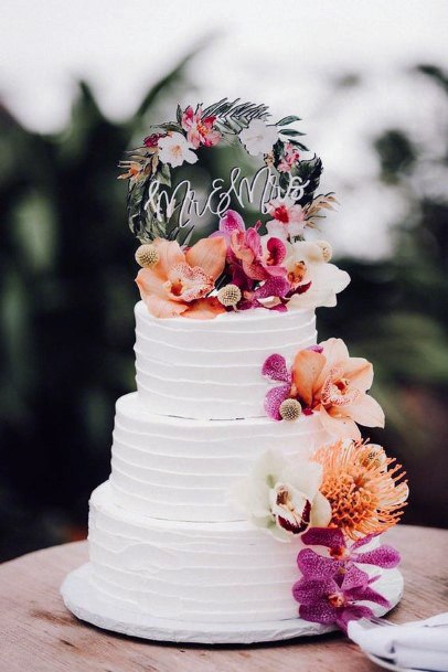 Tiered Cake With Tropical Flowers Beach Wedding Ideas