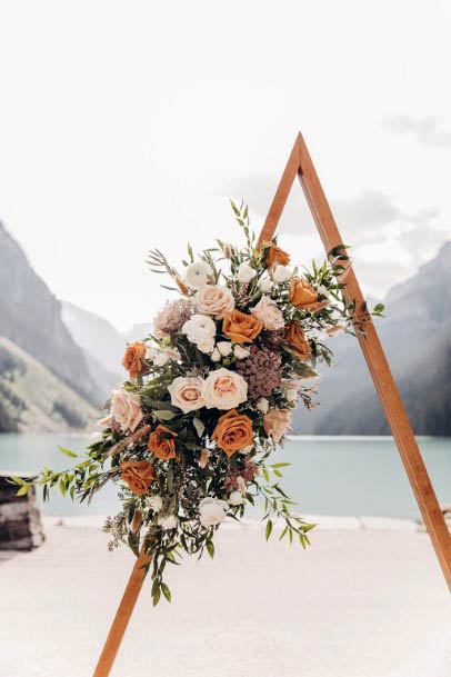 Triangular Arch With August Wedding Flowers