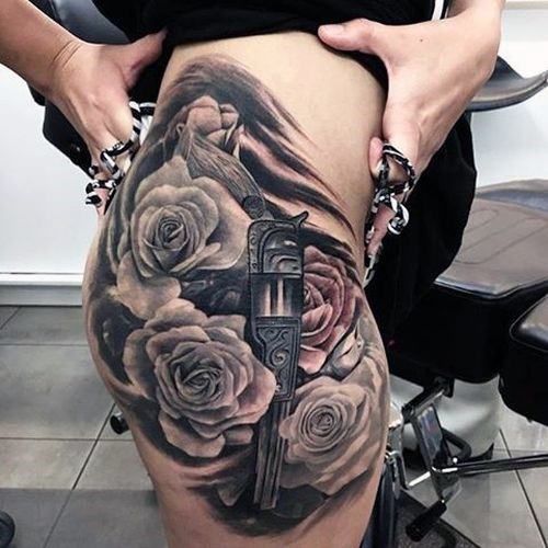 Trio Of Roses And Revolver Tattoo Womens Thighs