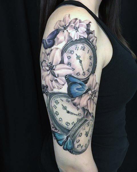 Tumbling Flowers And Clock Tattoo Womens Arms
