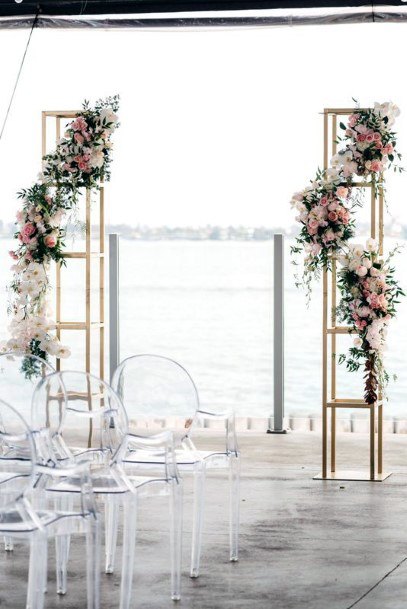 Two Gold Columns Cascading Florals Wedding Arch Ideas