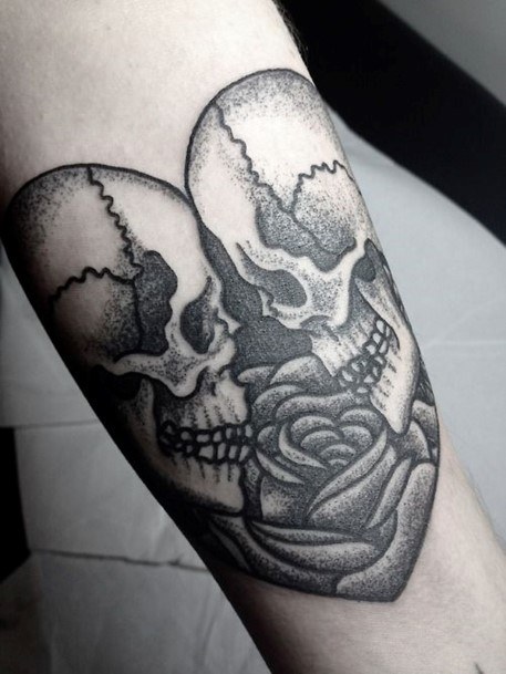 Two Skulls Forming A Heart Tattoo Womens Forearms