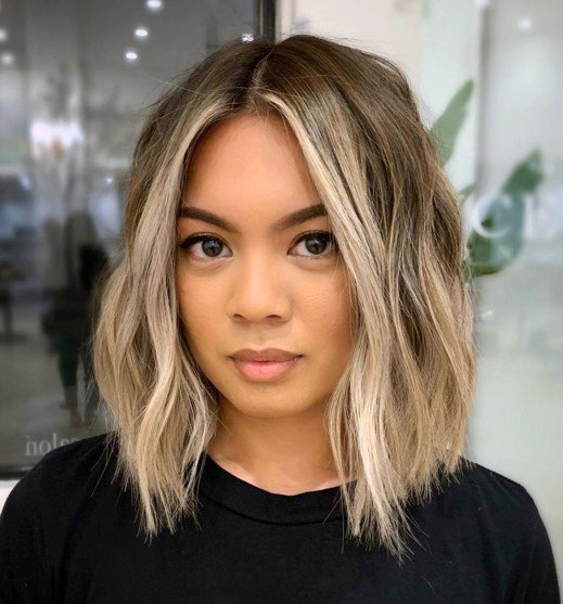 Ultra Modern And Hip Asian Woman Mid Length Blonde Highlights Fun Hair