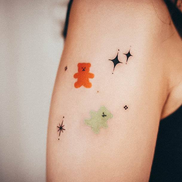 Upper Arm Stars Georgeous Gummy Bear Tattoo On Girl