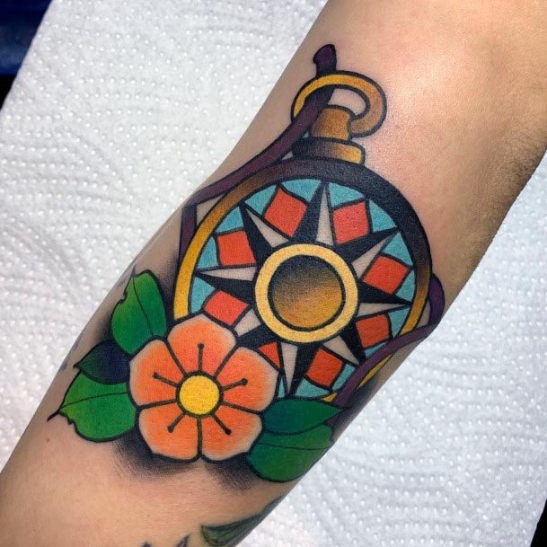 Very Bright Flowers And Compass Tattoo Womens Forearm