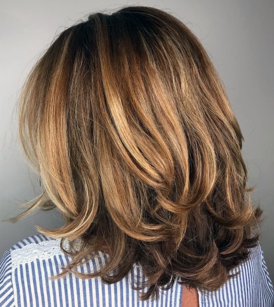 Vibrant Brown And Blonde Stand Out Textured Bouncy Women’s Hairstyle