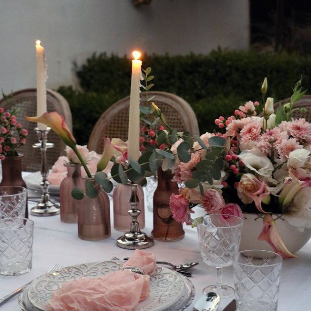 Warm Candles And Blush Roses Wedding Flowers