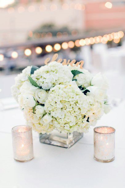 Warm Candles And Hydrangea Wedding Flowers