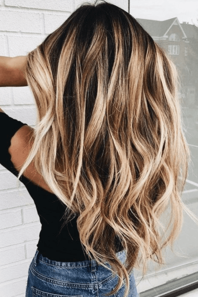 Wavy Blonde Bombshell Balayage For Ladies Looking For Summer Fun