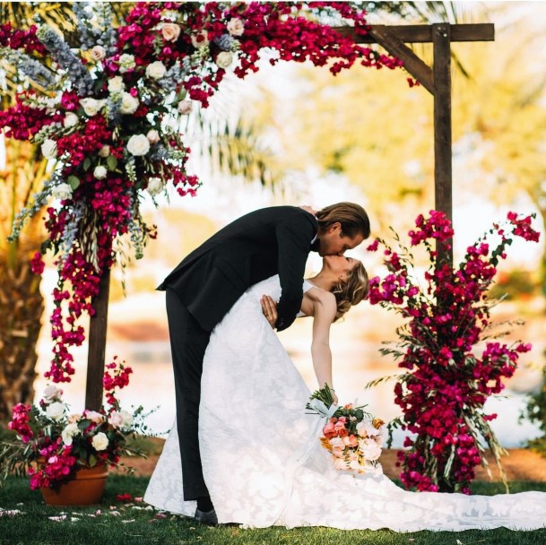 Wedding Arch Ideas Luxe Large Bouquets In Bright Reds And Fuscias Inspiration