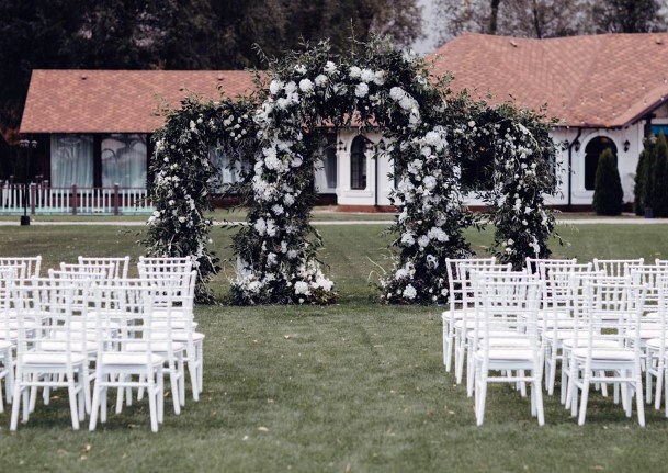 Wedding Arch Ideas Triple Arch Fully Wrapped In Greenery And Florals