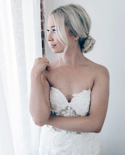 Wedding Hairstyle On Icy Blonde Female With Low Bun