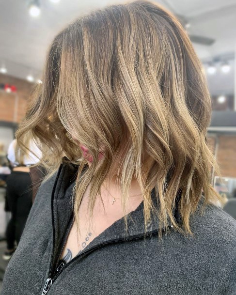 Wedge Shaggy Hairstyle On Dirty Blonde Shoulder Length Hair