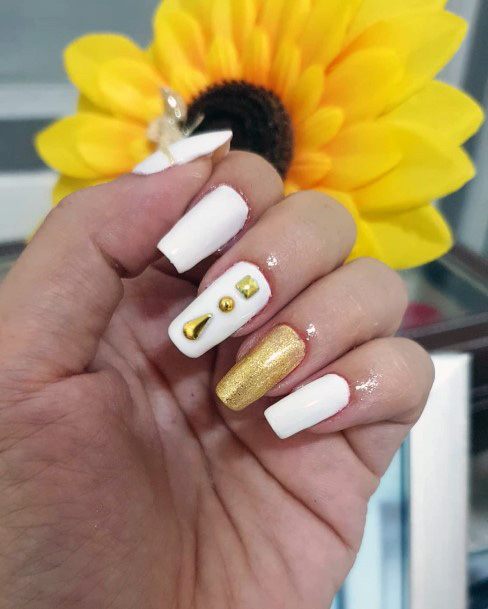 White And Glistening Gold Decorated Nails