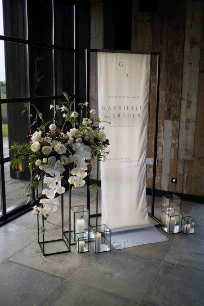 White Banner And Black Candle Stand Wedding Decor