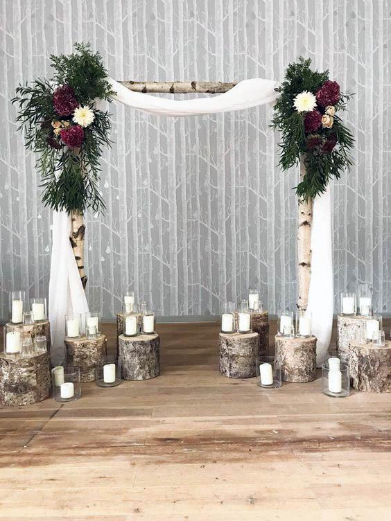 White Candles And Wedding Arch Flowers