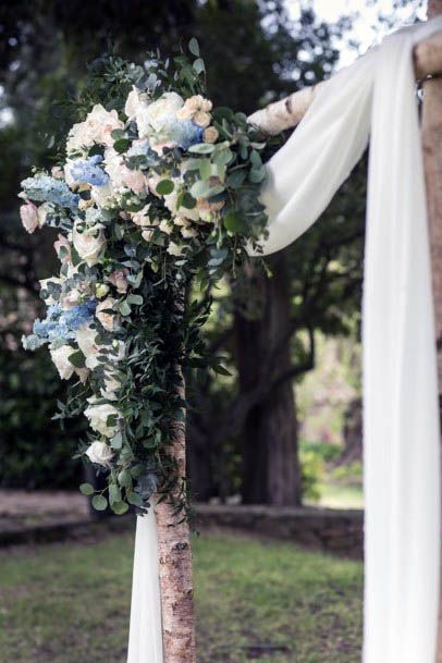 White Curtained And Blue Wedding Flowers