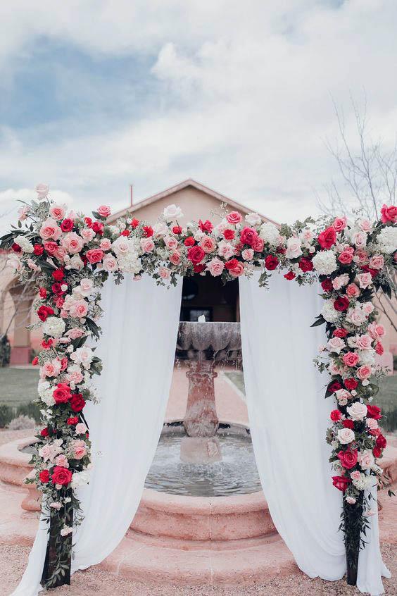 White Curtained Arch Wedding Flowers