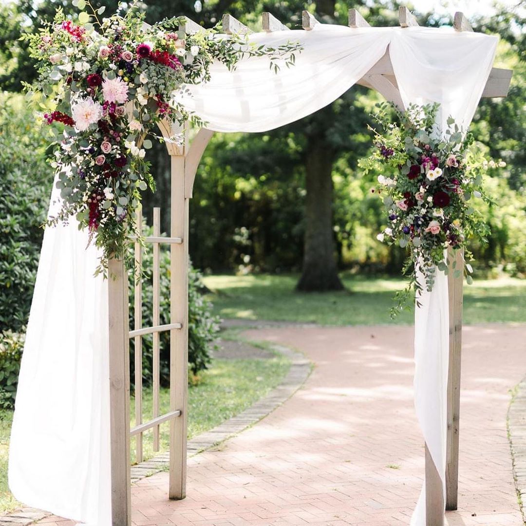 White Fabric And September Wedding Flower Arch