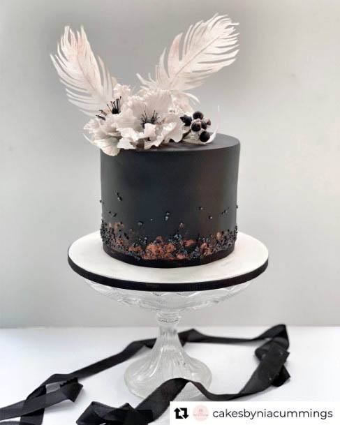 White Feathers And Black Cake Wedding Flowers