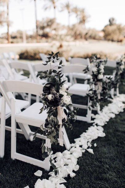 White Floral Pathway And Black Wedding Decor