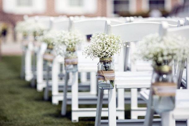 81673041 Jar With Flowers Hanging From Chair For Wedding