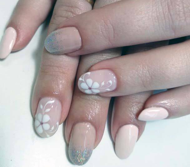 White Florals On Beauitful Nude Nails