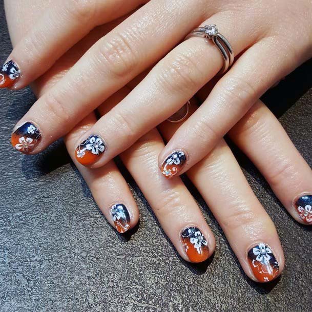 White Flower Art On Blue Orange Nails For Women