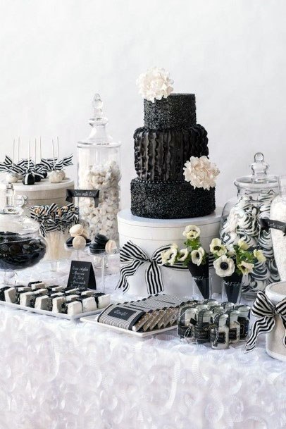 White Flowers And Black Cake Wedding Decor