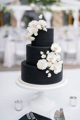 White Flowers On Black Cake Wedding Decor