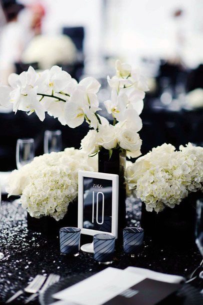 White Fluffy Flowers And Black Card Wedding Decor